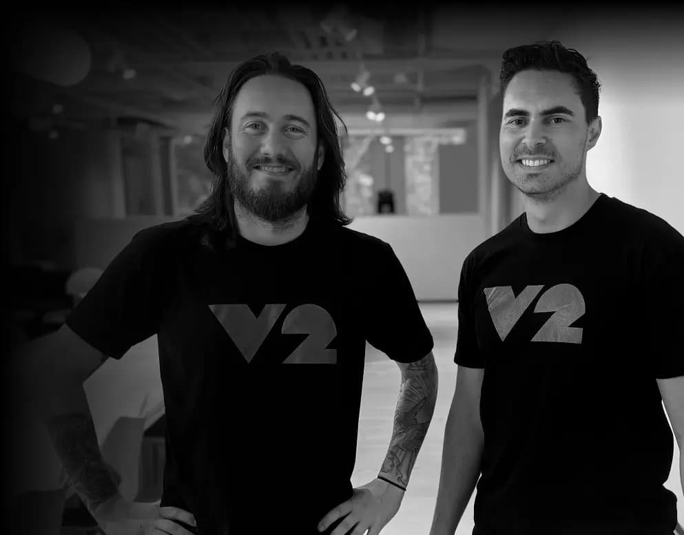 Grayscale photograph of two of V2 AI's high quality consultants
