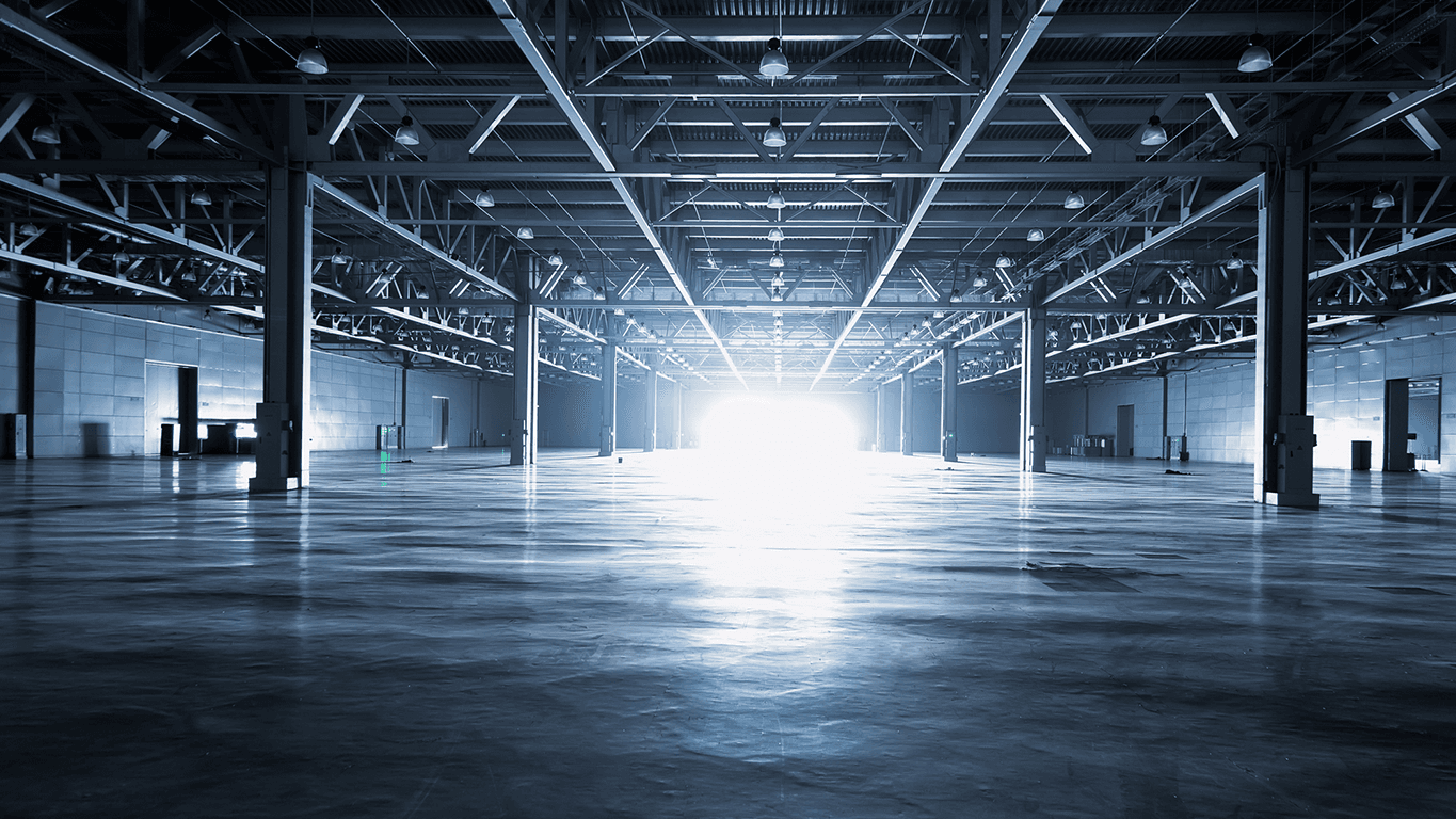 Image of an empty warehouse with a bright light at the end, symbolising the future of AI innovation.