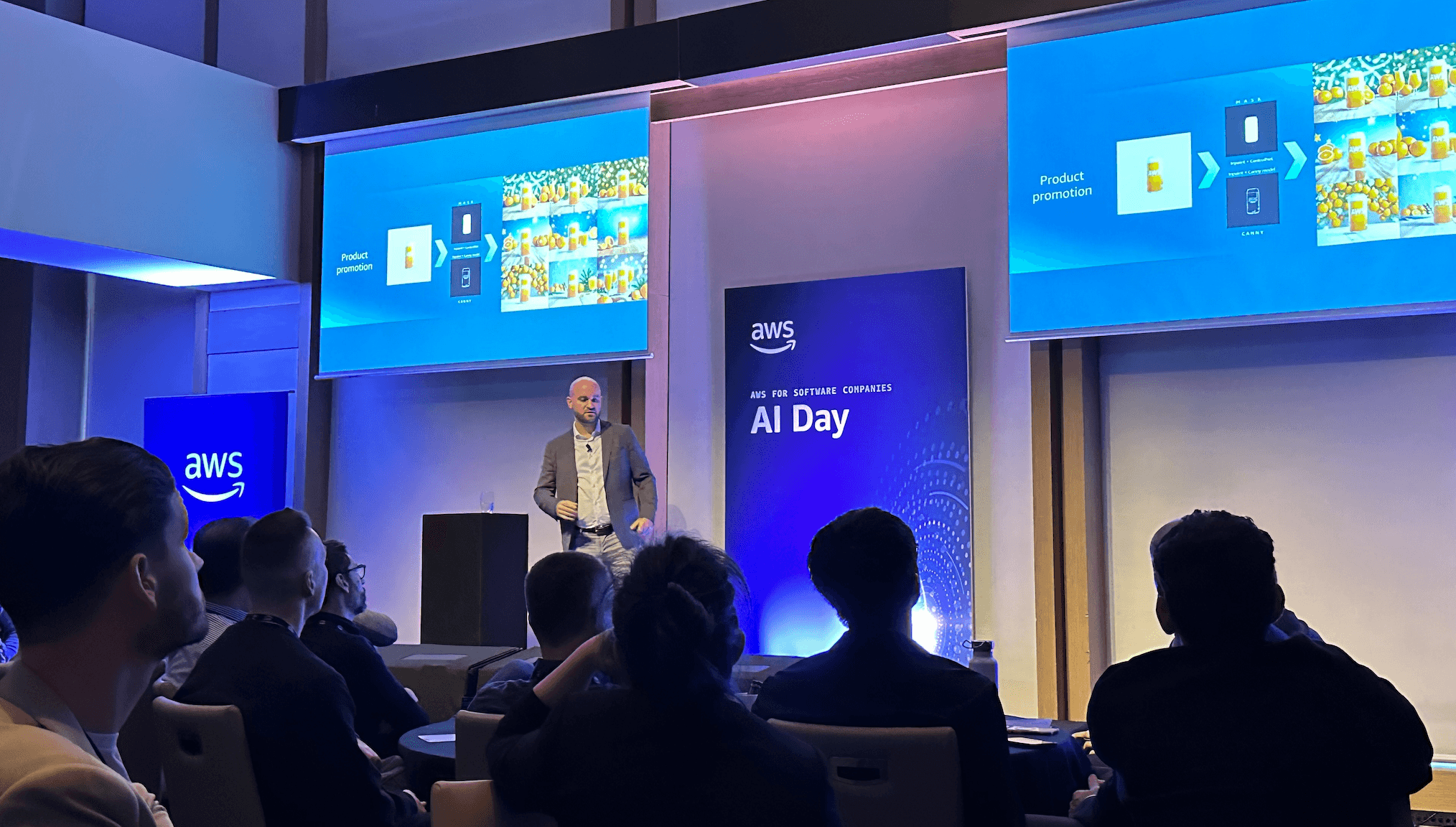 A keynote speaker at AWS AI Day Melbourne 2024 addressing a crowd of tech professionals and AI enthusiasts.